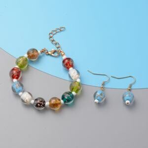 NWOT Multi Colored Glass Adjustable Bracelet and Earrings in Goldtone